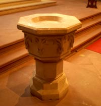 Eight-Sided Baptismal Font at the front of the church on the left side