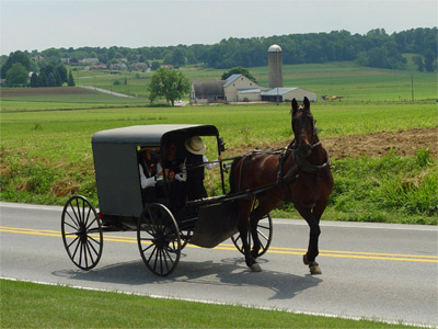 'Amish family riding in a traditional Amish buggy in Lancaster County, Pennsylvania, USA', TheCadExpert, 2004